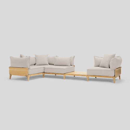 A studio photo of Bluff Sectional with In-line Table Sunbrella Parchment / Four Piece with In-line Table