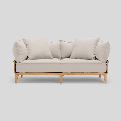 A studio photo of Bluff Loveseat Sunbrella Parchment