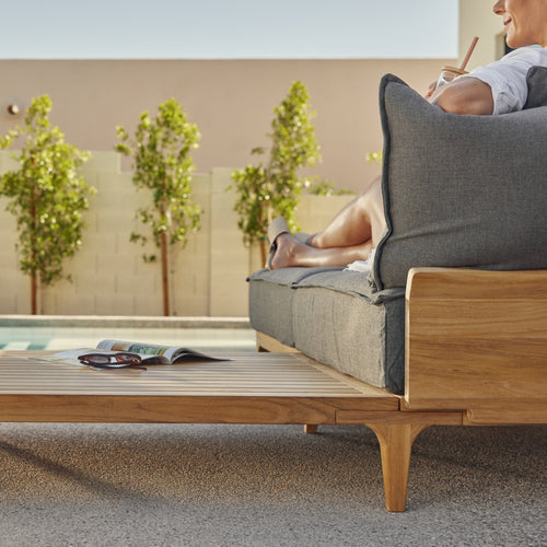 A studio photo of Bluff Sectional with In-line Table Sunbrella Parchment / Four Piece with In-line Table