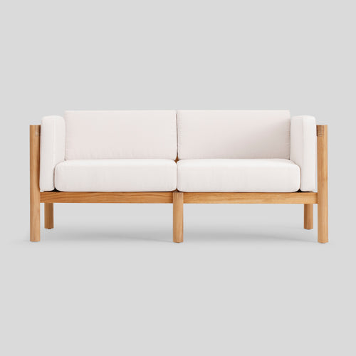 A studio photo of Haven Loveseat Sunbrella Canvas / Cushion Arm