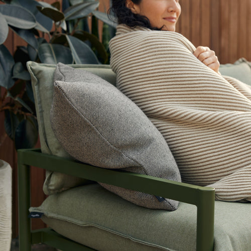 A studio photo of Terra Loveseat Putty